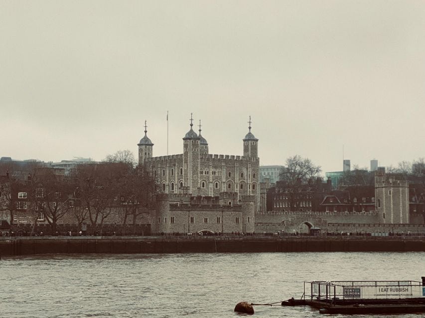 Top 10 Must See Attractions In London include the Tower of London as seen from across the Thames.